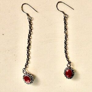 13 1/2inch long vintage silver tone unbranded earrings with a red stone.